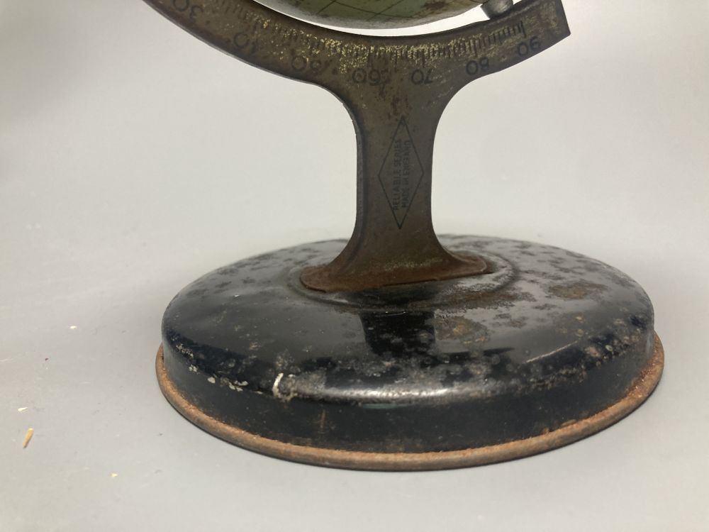 A Reliable Series lithographed tinplate revolving globe, 20cm, and two graphic globes,on ebonised wood bases, one by Philips